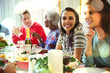 © Robert Daly/Caia Image - Portrait smiling woman enjoying Christmas dinner at table