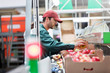 © Agnieszka Olek/Caia Image - Male worker inspecting apples in food processing plant