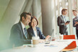 © Tom Merton/Caia Image - Businessman businesswoman meeting working at laptop in conference room