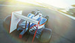 © Chris Ryan/Caia Image - Formula one race car on sports track