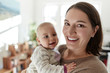 © Great Images/Caia Image - Portrait smiling mother and baby daughter