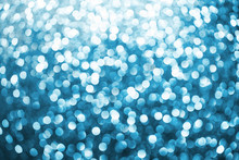 Blue Bokeh Shiny Glitter Background. Abstract Vibrant Color Glowing White Spots Texture For Graphic Design.