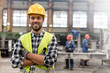 © Agnieszka Olek/Caia Image - Portrait smiling confident steel worker in factory