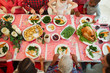 © Robert Daly/Caia Image - Overhead view family eating Christmas dinner