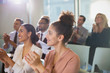 © Sam Edwards/Caia Image - Businesswomen clapping in conference audience