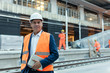 © Rafal Rodzoch/Caia Image - Portrait confident engineer with digital tablet at construction site