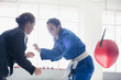 © Sam Edwards/Caia Image - Women practicing judo in gym