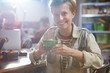 © Agnieszka Olek/Caia Image - Portrait smiling female engineer assembling circuit board in workshop