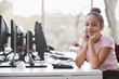 © Martin Barraud/Caia Image - Portrait confident girl student researching at computer in library