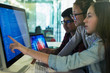 © Robert Daly/Caia Image - Students programming at computer in computer lab classroom