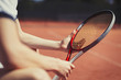 © Paul Bradbury/Caia Image - Young male tennis player holding tennis racket