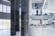 © Caiaimage/Martin Barraud/Caia Image - CEO businessman standing in modern office window