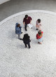 © Caiaimage/Martin Barraud/Caia Image - Business people with paperwork talking in courtyard