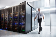 Male Security Guard Walking In Server Room