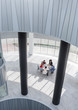 © Caiaimage/Martin Barraud/Caia Image - Business people meeting at table in modern office atrium