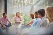 © Caiaimage/Agnieszka Olek/Caia Image - Therapist leading group therapy session