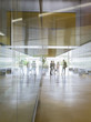 © Caiaimage/Martin Barraud/Caia Image - Business people talking in modern office lobby