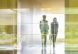© Caiaimage/Martin Barraud/Caia Image - Silhouette business people walking in modern office corridor