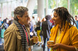 © Sam Edwards/Caia Image - Business people talking and drinking coffee at conference