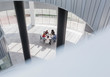 © Caiaimage/Martin Barraud/Caia Image - Business people meeting at table in modern office atrium