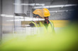 © Martin Barraud/Caia Image - Male supervisors talking, looking down in factory