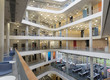 © TomMerton/Caia Image - Modern office atrium with balconies