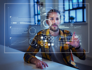 Businessman using futuristic hologram computer