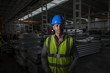 © Martin Barraud/Caia Image - Portrait confident, serious worker in dark steel factory