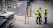 © Martin Barraud/Caia Image - Supervisor and workers talking in factory