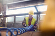 © Caiaimage/Agnieszka Olek/Caia Image - Steelworker using equipment in steel mill