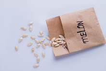 Paper Package Of Melon Seeds. White Isolated Background.