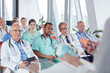 © Agnieszka Olek/Caia Image - Surgeons, doctors and nurses listening in conference audience