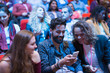 © Tom Merton/Caia Image - Smiling business people using smart phone in conference audience