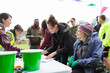 © Sam Edwards/Caia Image - Runners checking in at charity run