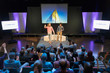 © Tom Merton/Caia Image - Audience clapping for photographers on stage