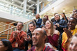 © Sam Edwards/Caia Image - Smiling conference audience clapping