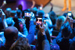 © Tom Merton/Caia Image - Audience using camera phones