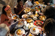 © Sam Edwards/Caia Image - Family enjoying Caribbean Christmas dinner