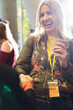 © Martin Barraud/Caia Image - Smiling woman with coffee at conference