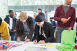 © TomMerton/Caia Image - Business people checking in at conference registration table