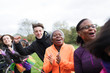 © Sam Edwards/Caia Image - Enthusiastic spectators cheering at charity run in park