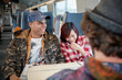 © Agnieszka Olek/Caia Image - Young couple laughing on passenger train