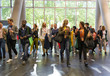 © Martin Barraud/Caia Image - Business people arriving at conference, walking in lobby