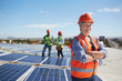 © Trevor Adeline/Caia Image - Portrait confident female engineer at sunny solar power plant