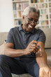 © Tom Merton/Caia Image - Smiling senior man taking insulin