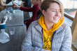 © Chris Ryan/Caia Image - Smiling young woman dining at restaurant outdoor patio