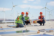 © Trevor Adeline/Caia Image - Engineers installing solar panels at alternative energy power plant