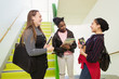 © Rob Daly/Caia Image - High school girls talking on stair landing