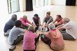 © Martin Barraud/Caia Image - Active seniors exercising, stretching legs in circle