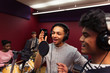 © Sam Edwards/Caia Image - Teenage musicians recording music in sound booth